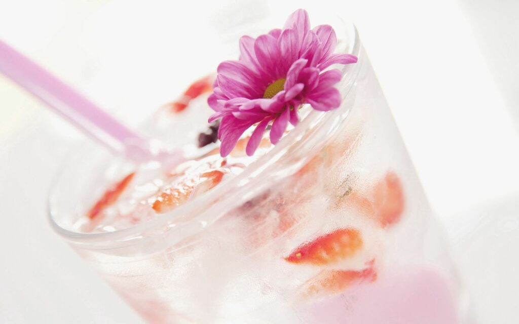 Refreshing Strawberry Cocktail with Ice & Purple Flower Wallpaper