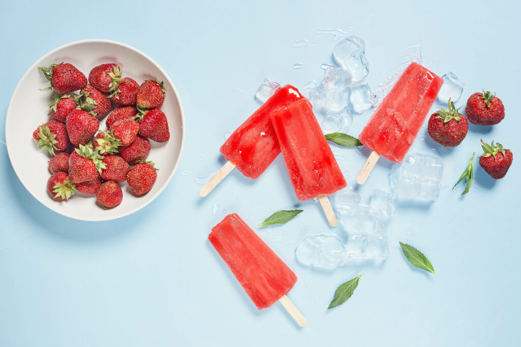 Vibrant Strawberry Popsicles Wallpaper - Refreshing Summer Delight