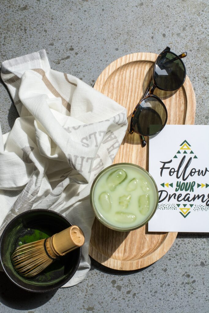Summer Vibes: Iced Drink, Sunglasses & Dream Card on Rustic Tray Wallpaper