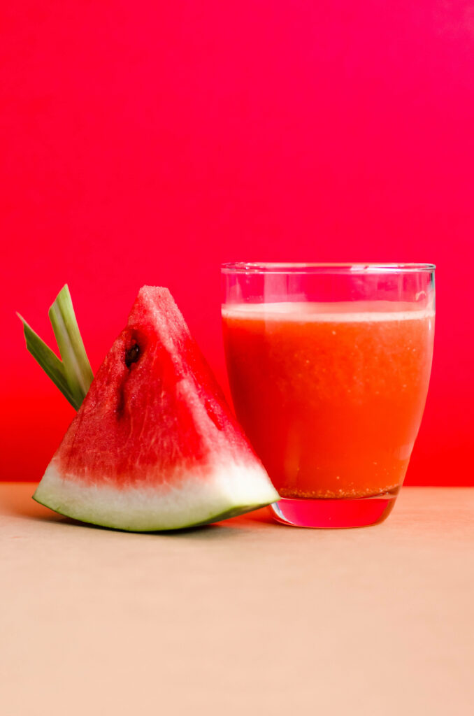 Refreshing Summer Vibes: A Colorful Slice of Watermelon and Juicy Glass of Watermelon Delight Wallpaper
