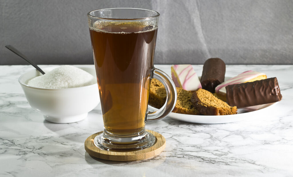 Refreshing Tea with Sweets on Marble Surface - Beautiful Wallpaper