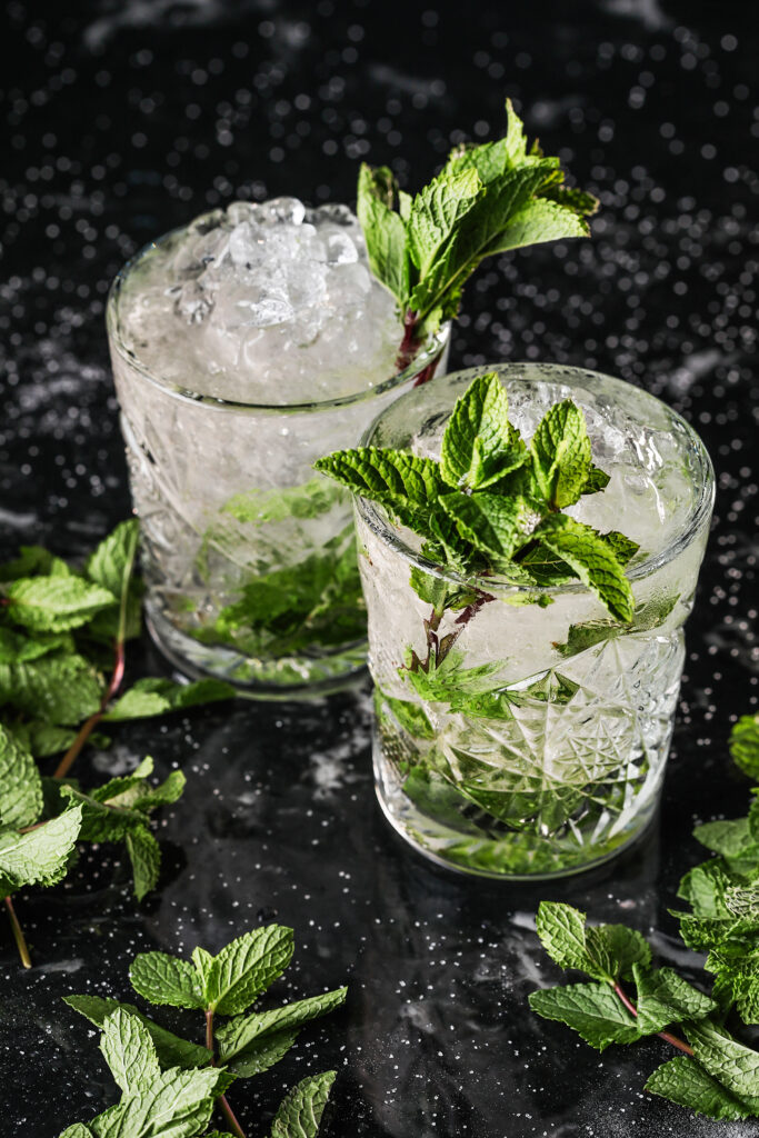 Refreshing Mint Ice Water Wallpaper: Cool Drink Setup on Dark Background