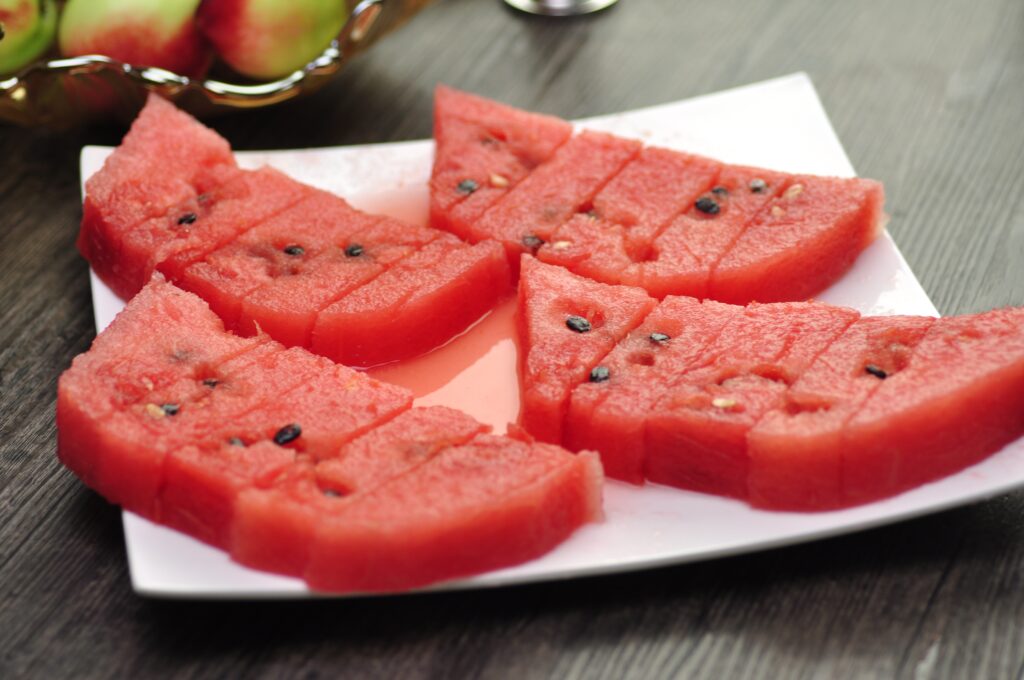 Vibrant Watermelon Wallpaper: Juicy Slices with Mixed Fruits Background