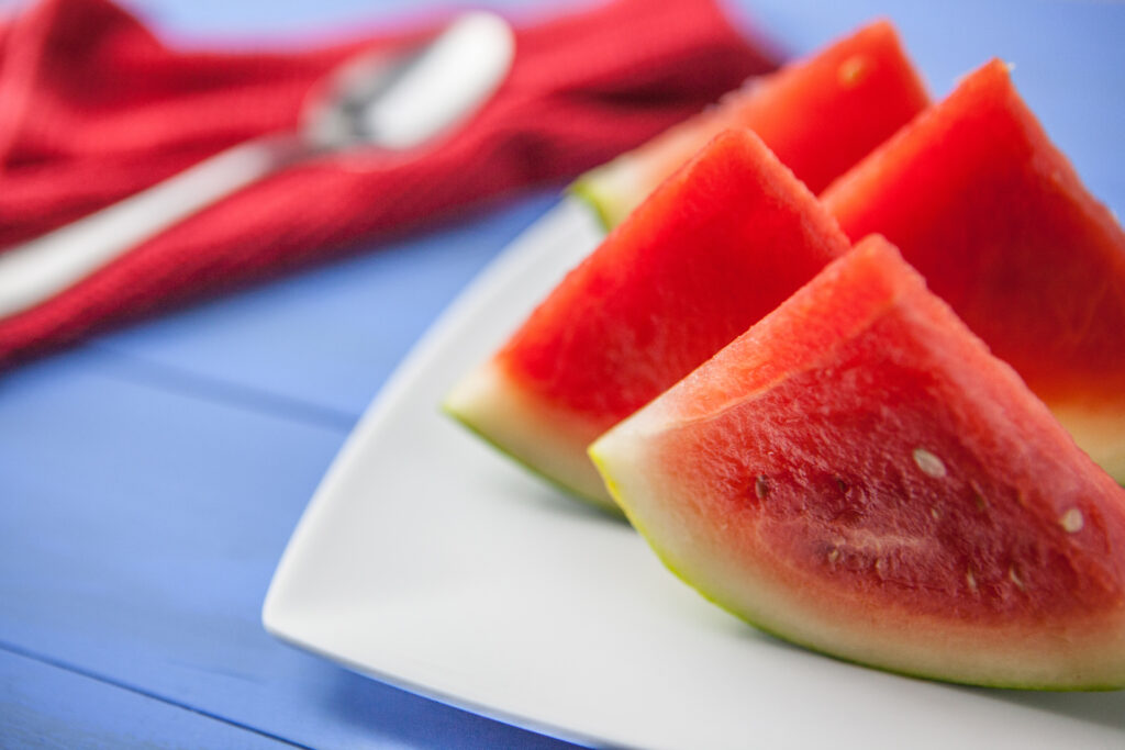 Juicy Watermelon Wallpaper: Vibrant Slices on White Plate