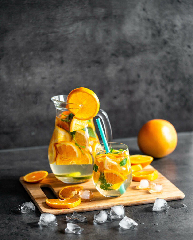 Refreshing Orange-Infused Water iPhone Wallpaper with Mint & Ice