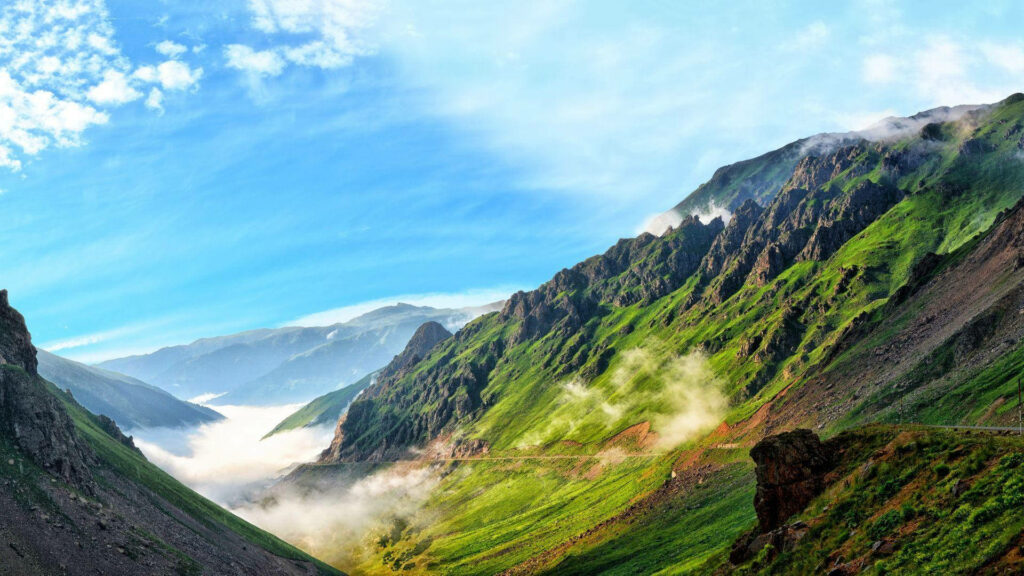Immerse Yourself in the Tranquil Majesty of Serene Mountain Landscapes Wallpaper