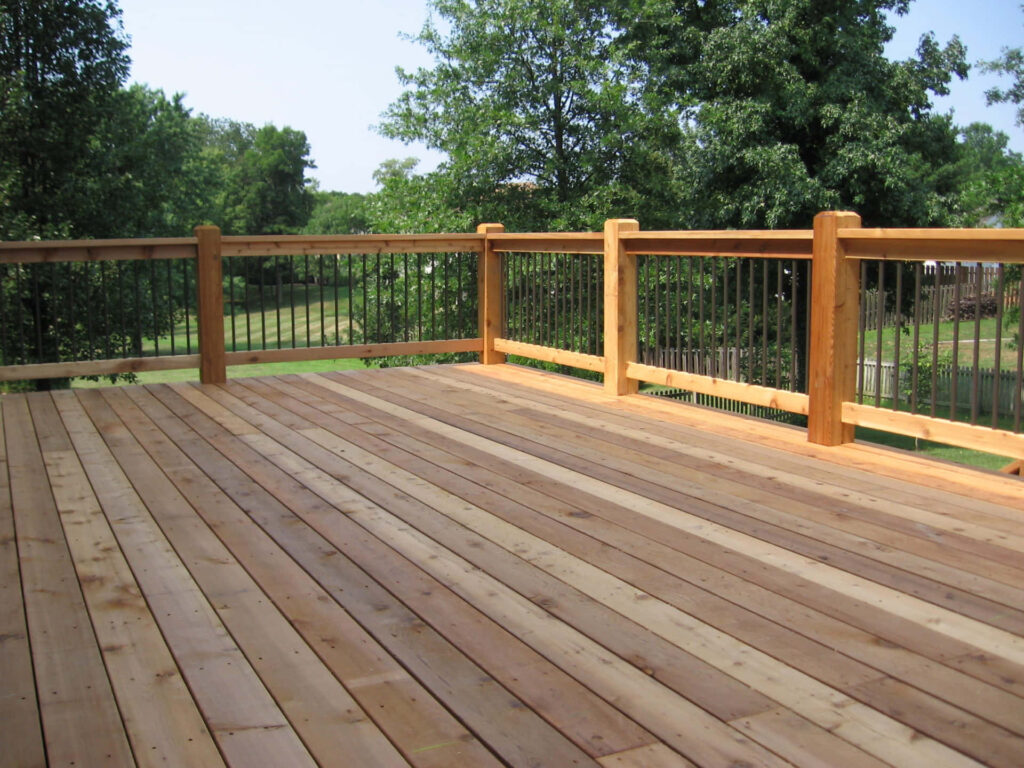 Spacious Cedar Deck Surrounded by Lush Greenery - Outdoor Oasis Wallpaper
