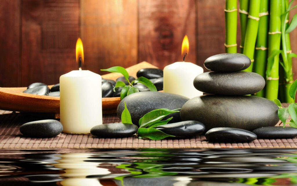 Zen Oasis: A Serene 4K Wallpaper of Green Bamboo, Candles, and Hot Stones for Ultimate Relaxation