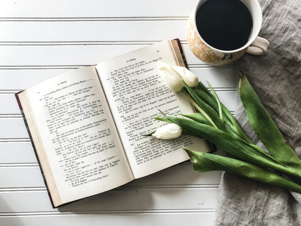 “Relaxing Wallpaper: Open Book, White Tulips & Coffee on Linen”