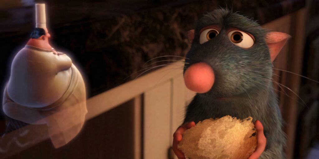 Thoughtful Remy the Rat with Bread in Warm Kitchen – Wallpaper