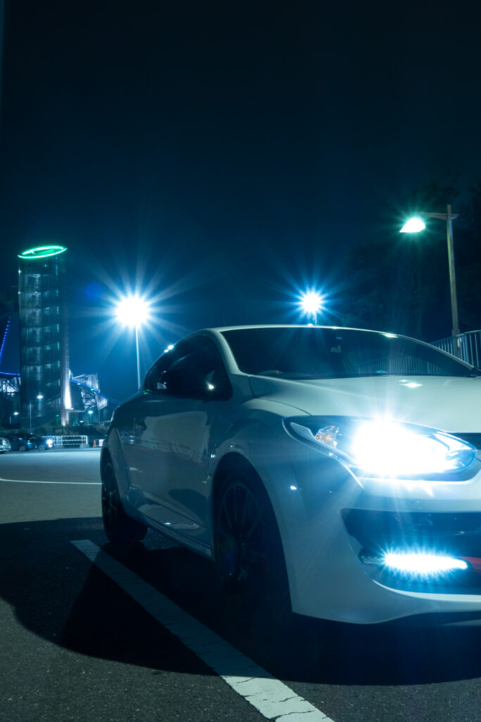 Renault Megane at Night: Sleek Urban Wallpaper with City Lights