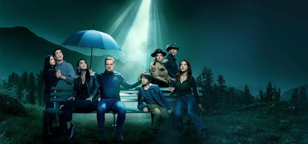 Resident Alien TV Series Wallpaper: Vibrant Cast at Night