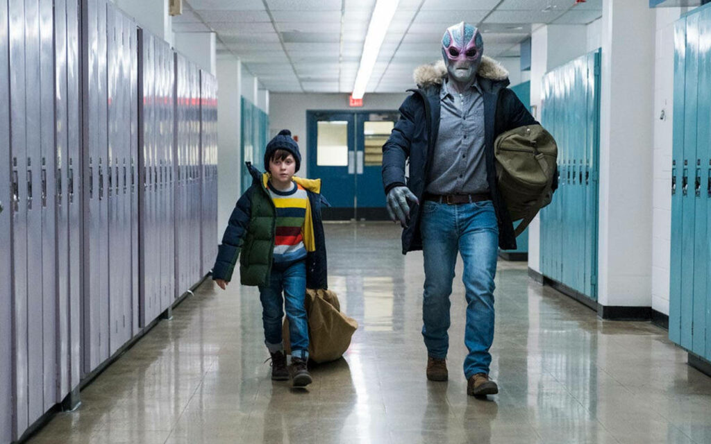 Resident Alien Scene: Characters Walking in School Hallway Wallpaper