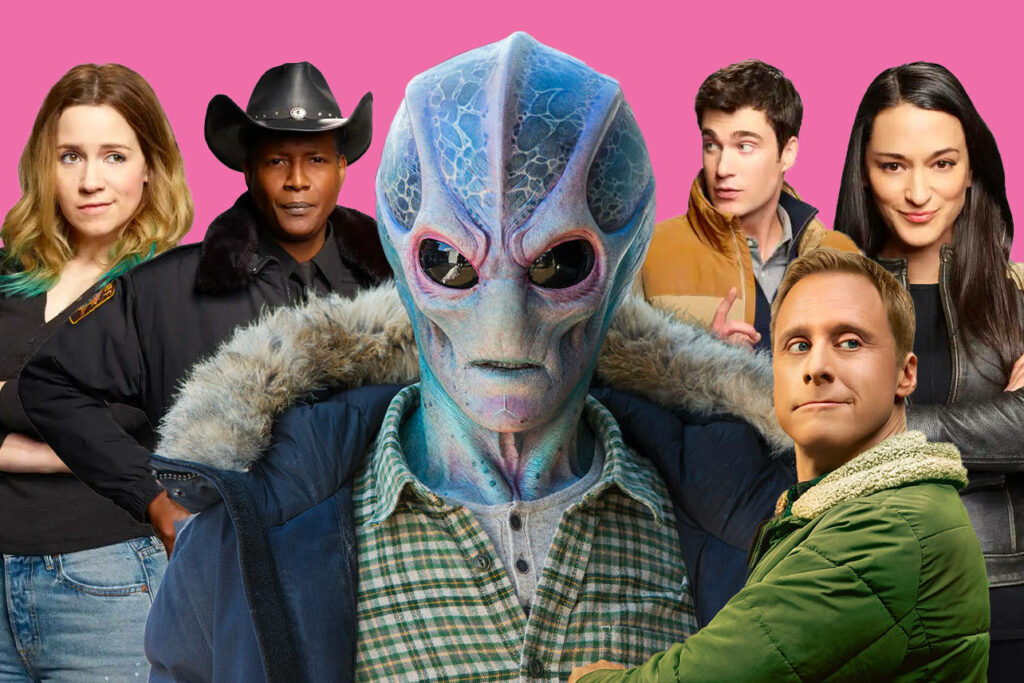 Resident Alien Cast Wallpaper: Quirky Comedy on Vibrant Pink Background