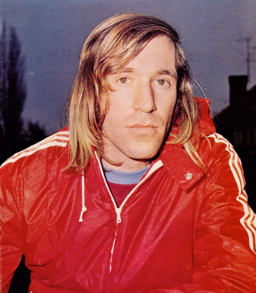 Günter Netzer 1970s retro football portrait vintage red jacket iconic German soccer legend wallpaper