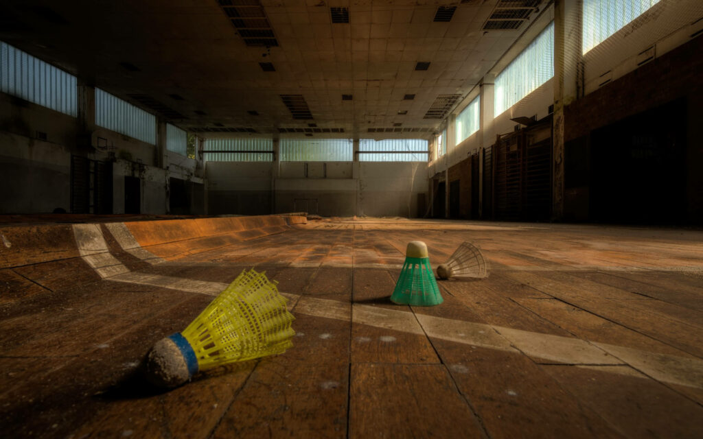 Forgotten Beauty: Abandoned Badminton Court Embraces Vibrant Remnants Wallpaper