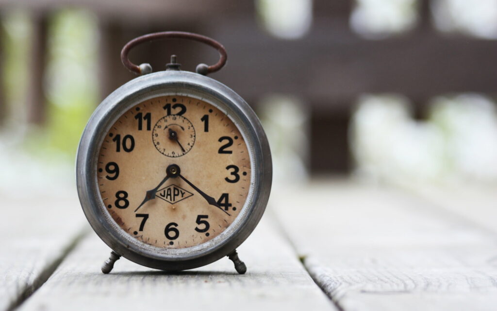 Time Transcended: A Nostalgic Journey through the Blur of Retro Clocks Wallpaper