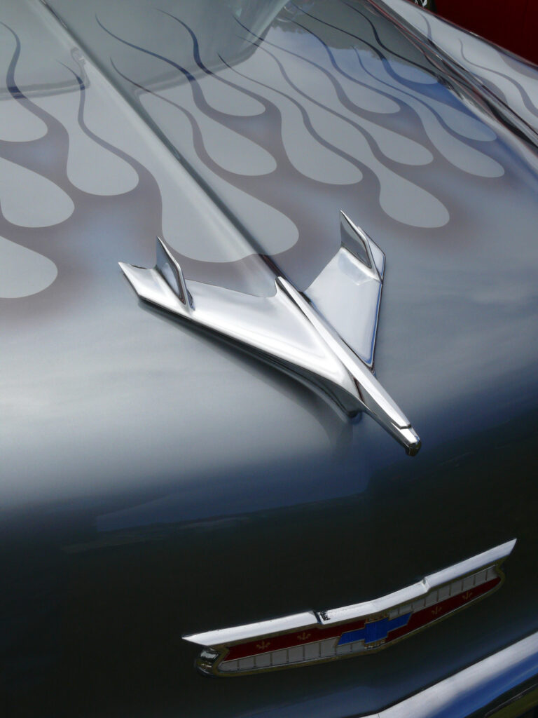 Retro Chevrolet Close-Up: Classic Blue with Flame Design Wallpaper