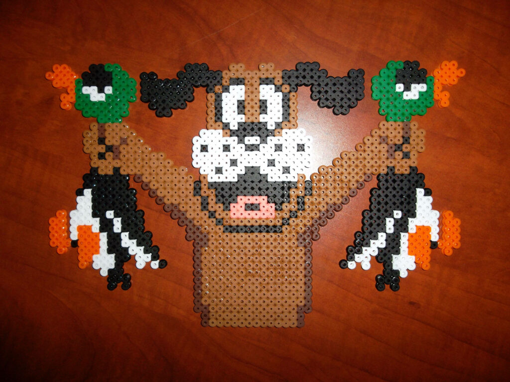 Pixel bead art of Duck Hunt dog holding two ducks retro video game style on wooden background Wallpaper