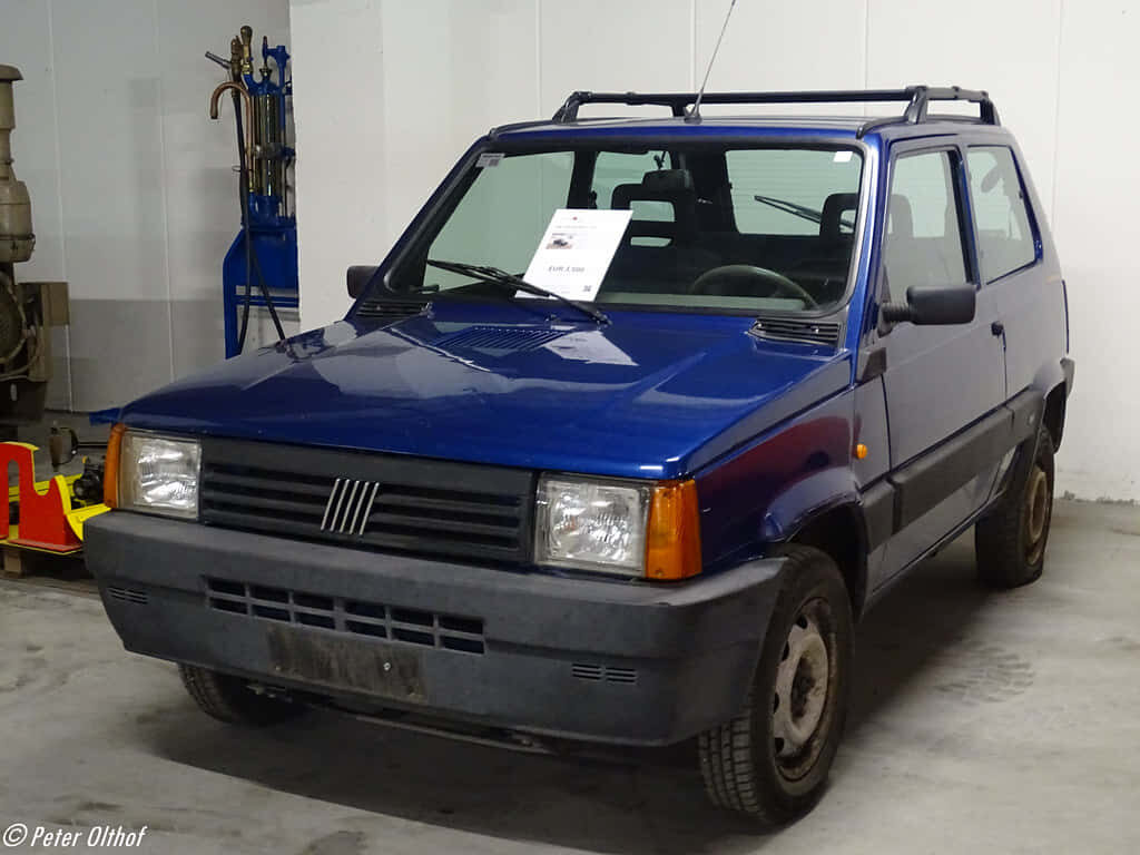 Retro Fiat Panda Wallpaper: Classic Blue Design for Your Background