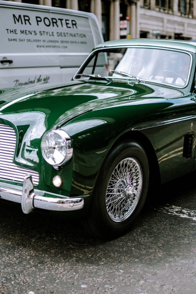 Stunning Retro Green Car Wallpaper with Gleaming Chrome Accents