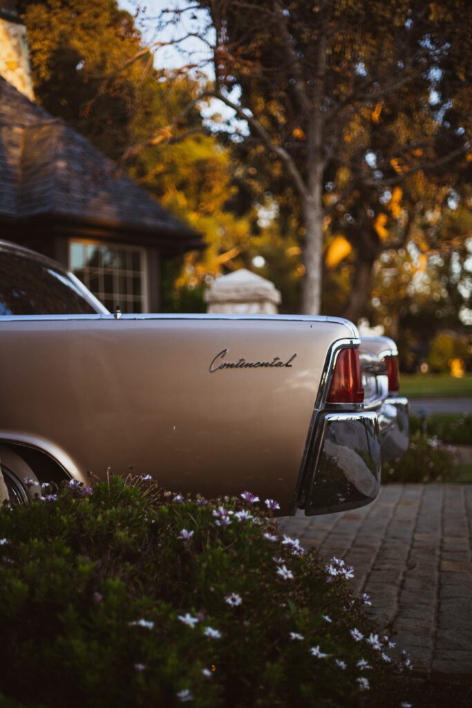Elegant Lincoln Continental Wallpaper: Retro Side View in Nature
