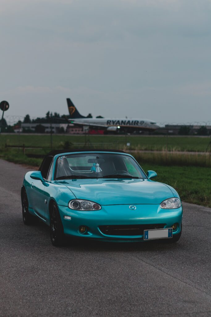 Retro Mazda Car Wallpaper: Turquoise Vintage Style & Ryanair Plane