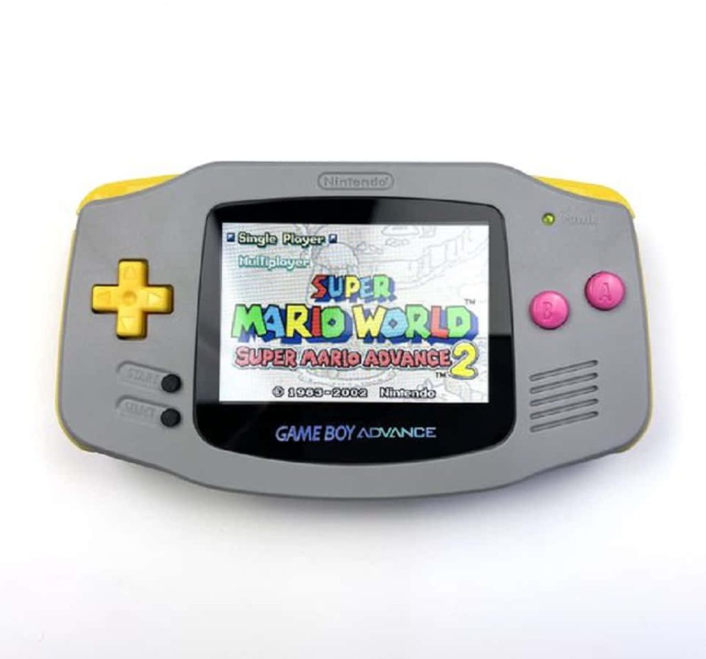 Nintendo Game Boy Advance gray console with yellow buttons showing Super Mario Advance 2 screen Wallpaper