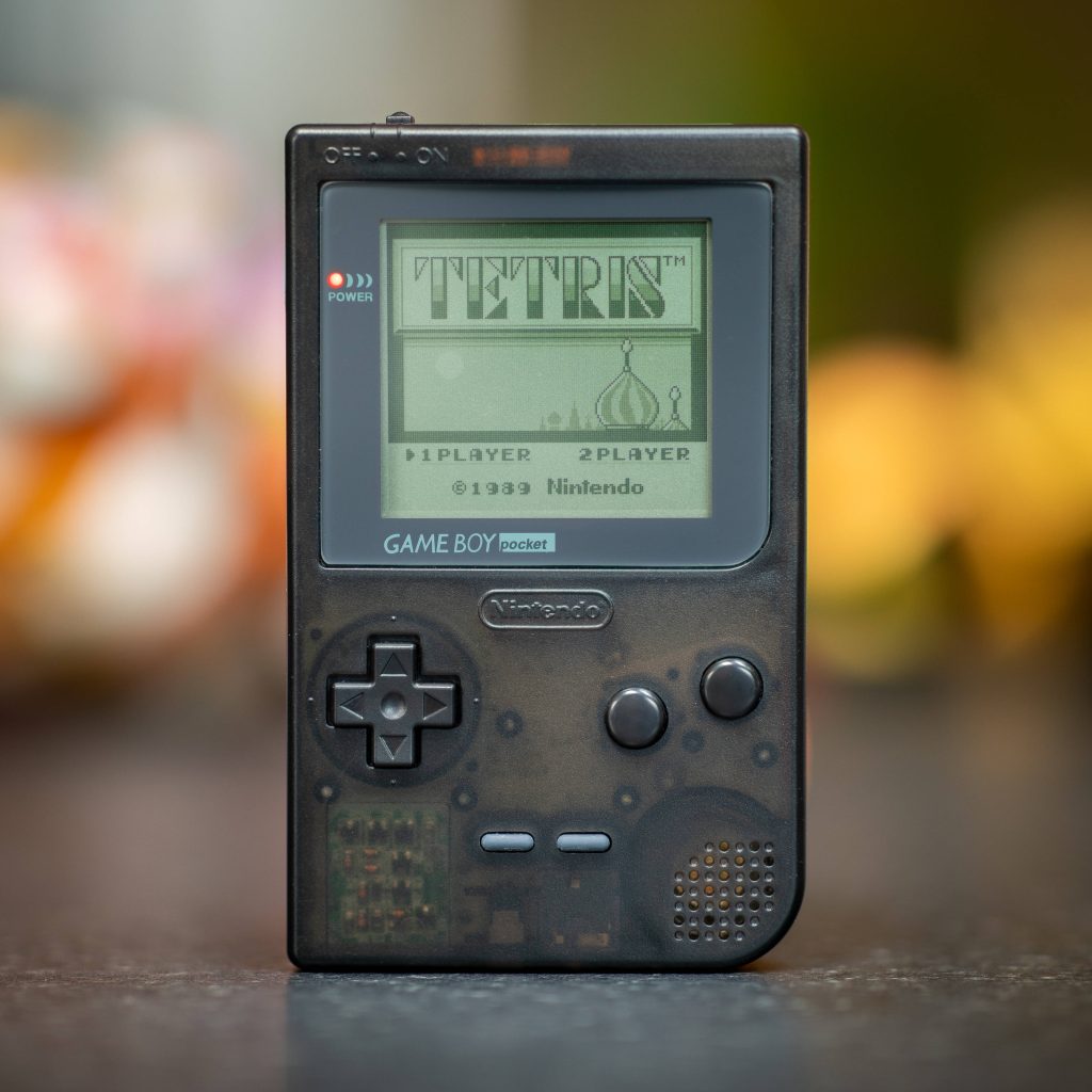 Macro photo of translucent black Nintendo Game Boy Pocket showing 1989 Tetris screen retro gaming Wallpaper