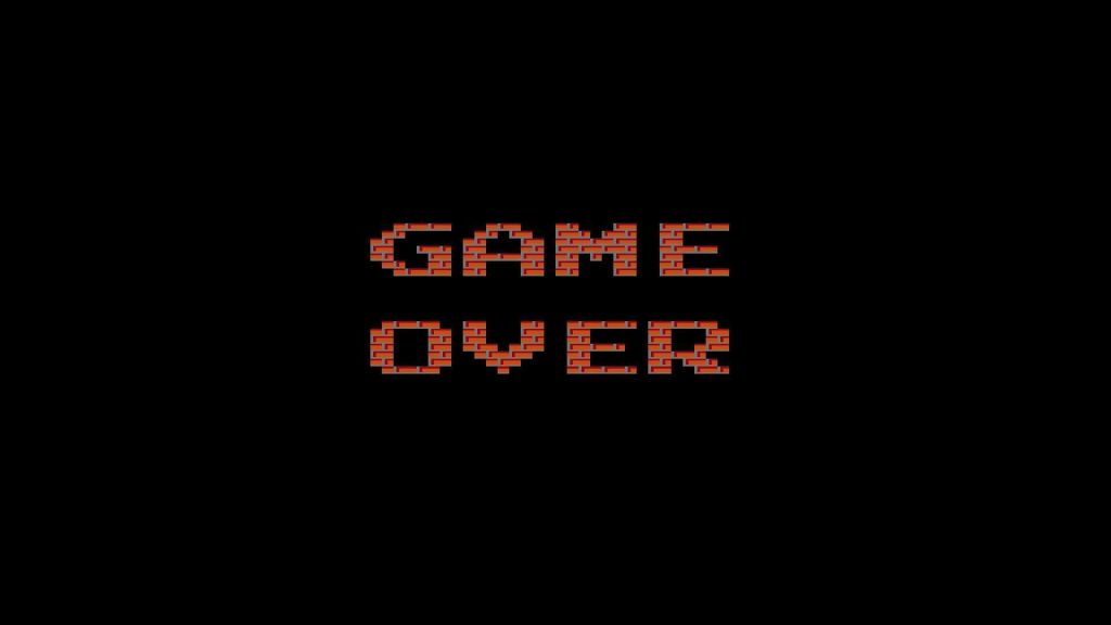 Pixelated red brick Game Over text on black background retro 8-bit gaming wallpaper design