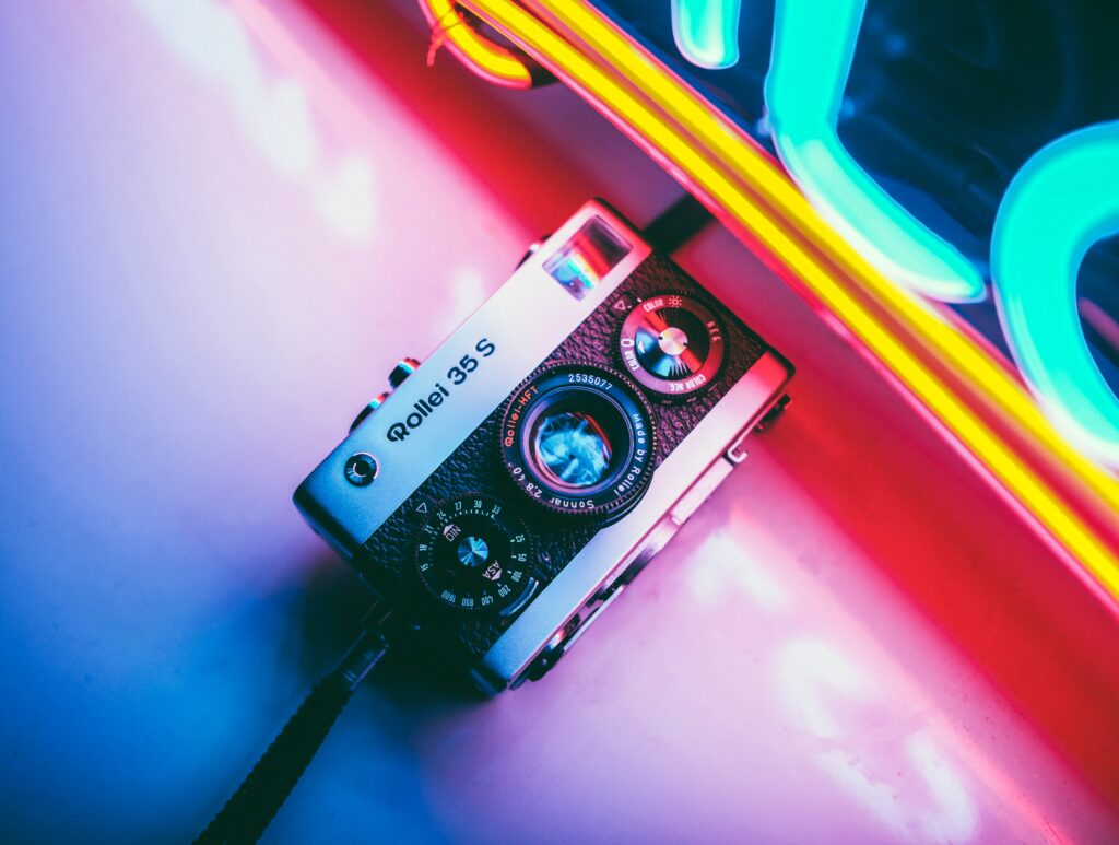Retro Rolleiflex 35 S Camera Wallpaper with Neon Lights Background