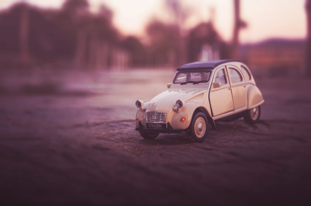 Retro Toy Car Wallpaper: Classic Design with Soft Focus Background