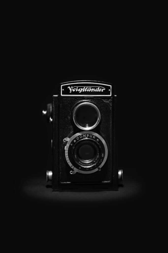 Vintage Voigtländer Camera Wallpaper: Elegant Retro Background