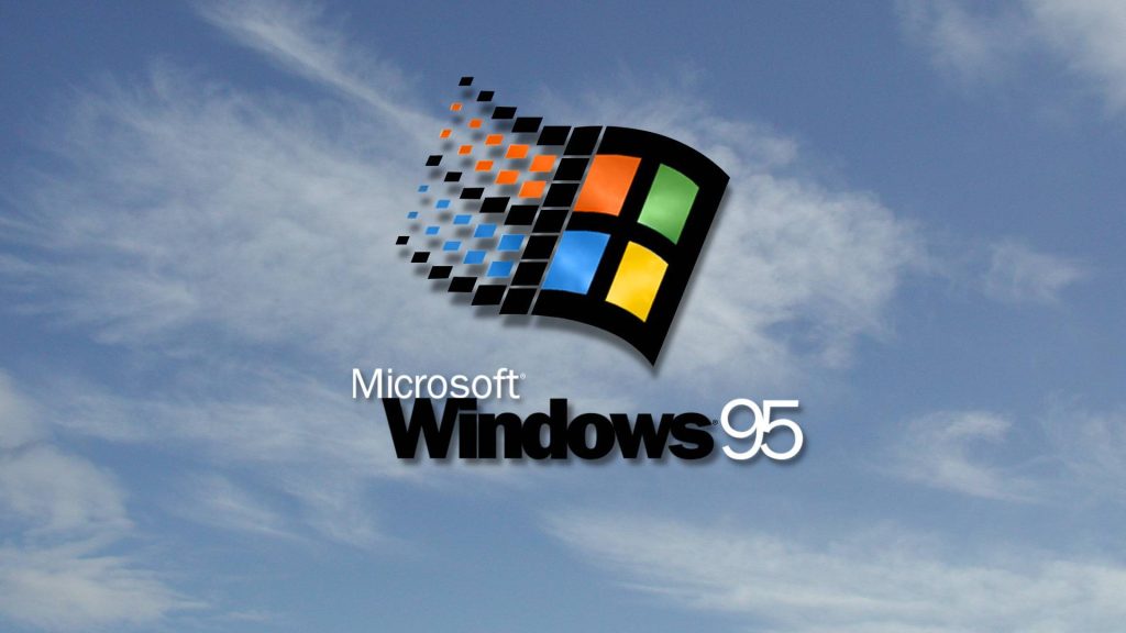 Retro Windows 95 wallpaper with multicolored pixelated Microsoft logo on blue sky background