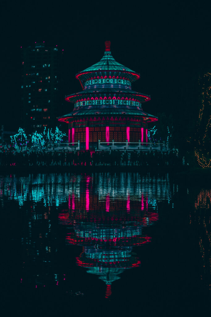 Retrowave Reverie: Serenity of the Illuminated Pagoda Amidst Nocturnal Tranquility Wallpaper
