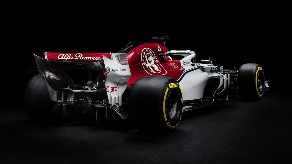 Alfa Romeo Sauber C37 F1 car red white livery on sleek black studio background wallpaper