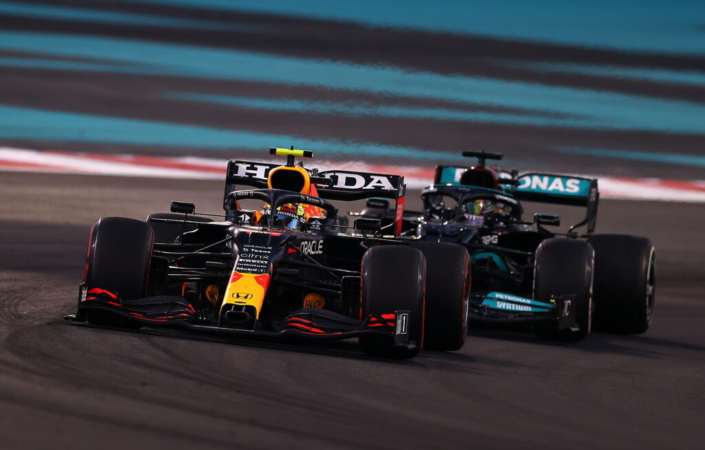Revving Up for the Race: 4K Wallpaper Featuring Red Bull Racing and Mercedes F1 Formula Cars in the Ultimate Formula 1 Showdown