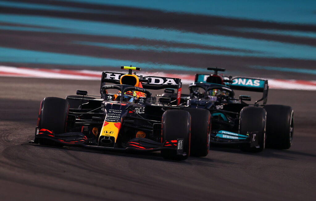High speed 2021 F1 battle Red Bull Max Verstappen vs Mercedes Lewis Hamilton Yas Marina wallpaper