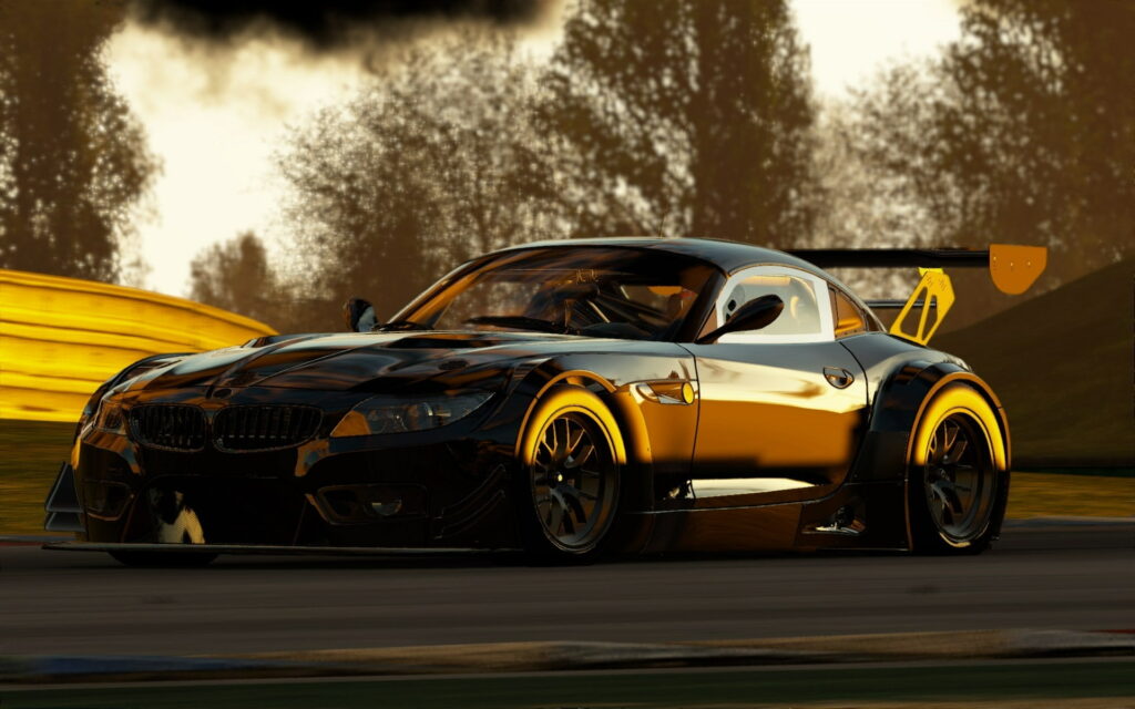 Dazzling Elegance: The BMW Z4 GT3 (E89) Roars in Reflective Black and Gold Amidst the Sunset's Radiant Embrace Wallpaper