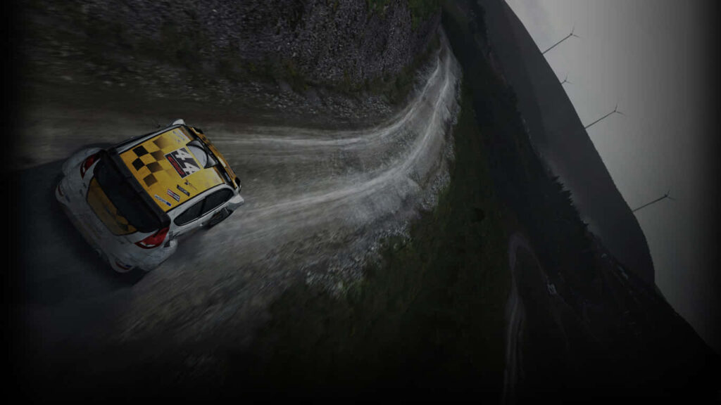 Dirt Rally Video Game Wallpaper: Rally Car Drifting on Gravel Track