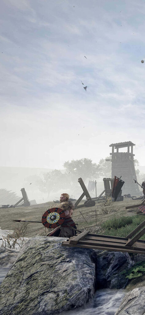 Medieval warrior in Mordhau game, armored and battle-ready, amidst siege weapons and ruins Wallpaper