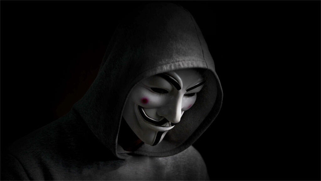 Empower Your Screen with the Join the Revolution – Wear the Guy Fawkes Mask Wallpaper