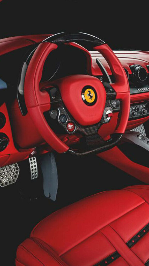 Exquisite Ferrari Charm: Captivating Red Car Interior and Steering Wheel as an Epic Phone Wallpaper