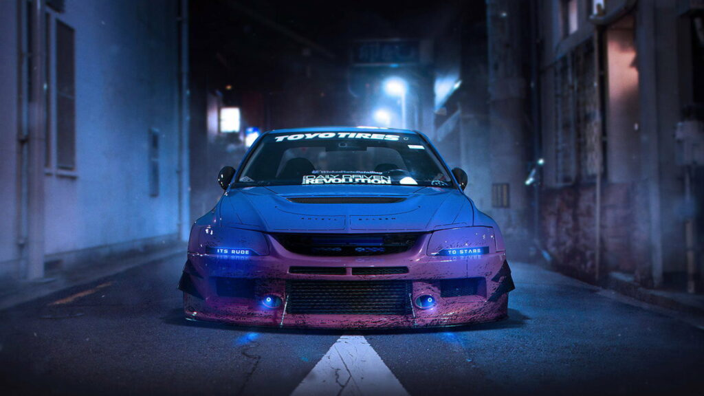 Racing Dreams: Captivating HD Wallpaper Featuring a Stunning Blue Mitsubishi Lancer Evolution JDM Car