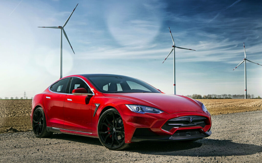 Rev up your screens with a customized Red Tesla Model S by Larte Design, complete with Wind Turbines in the background – a Wallpaper must-have!