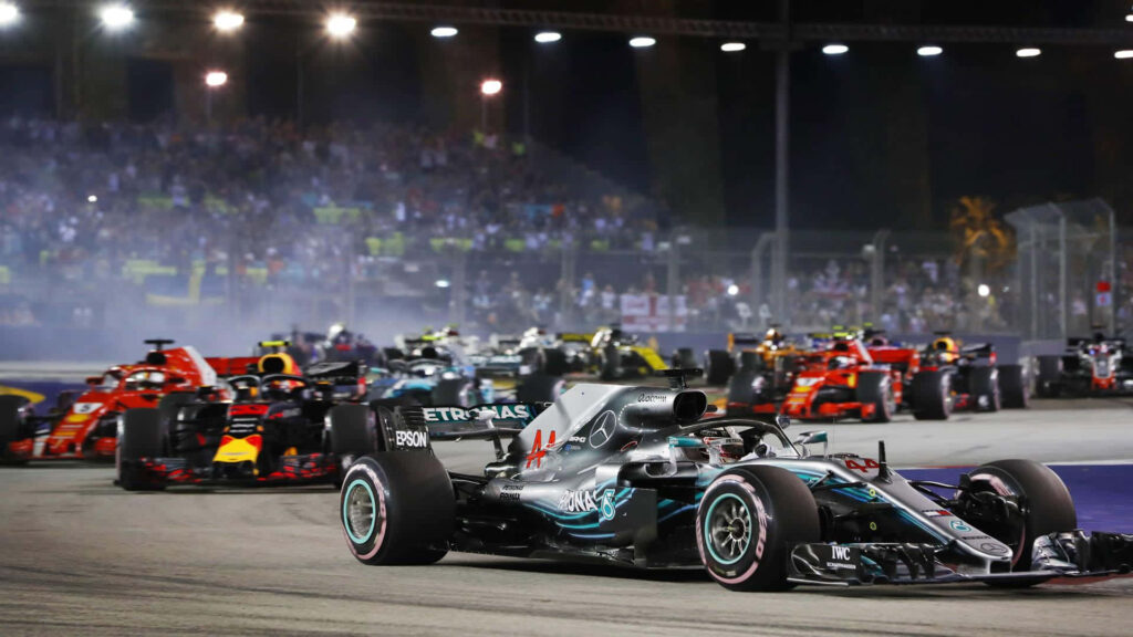 F1 Game Thrill: High-Speed Action on the Race Track with Powerful Race Cars Wallpaper