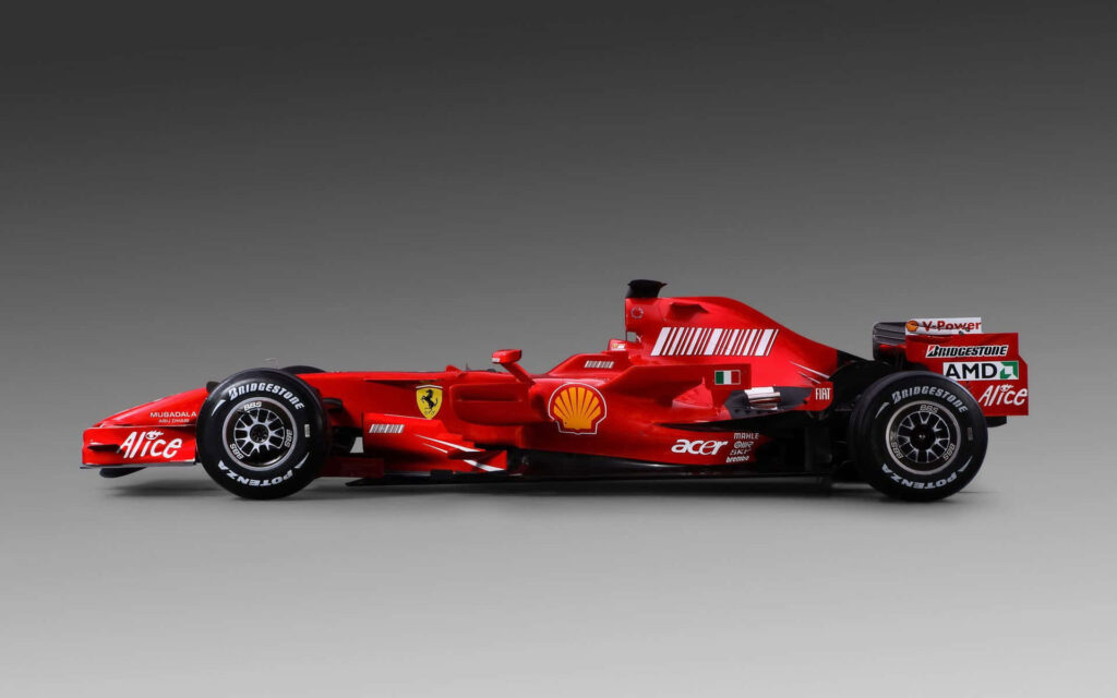 The Ultimate Speed Machine: Vibrant Ferrari F1 Raring to Conquer the Track Wallpaper