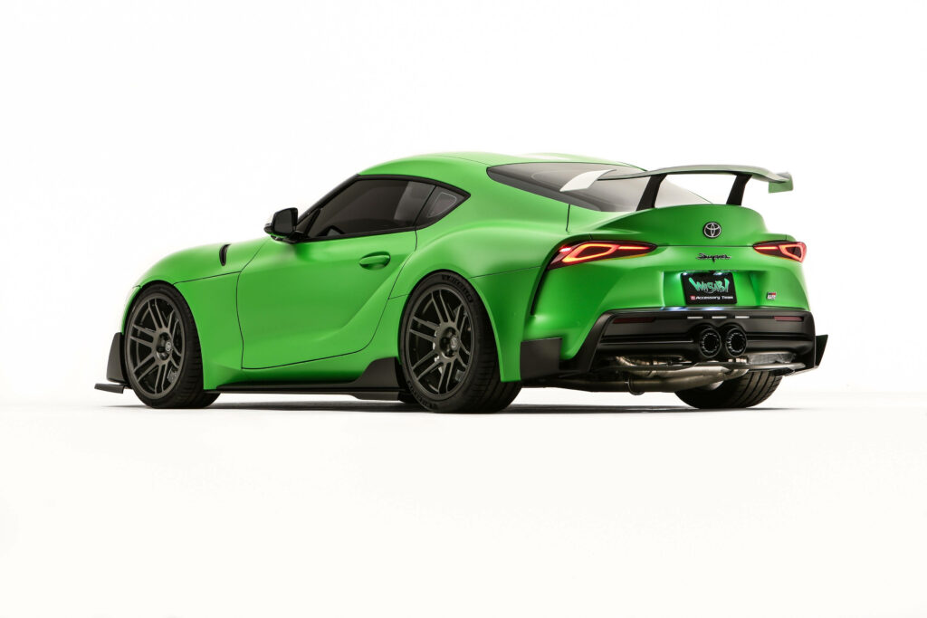 Revving in Style: A Dark Green Toyota Supra Wallpaper with Striking Red Rear Lights