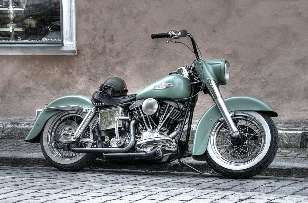 Riding the Green Beast: An HD Wallpaper of a Powerful Harley Davidson Chopper Motorcycle