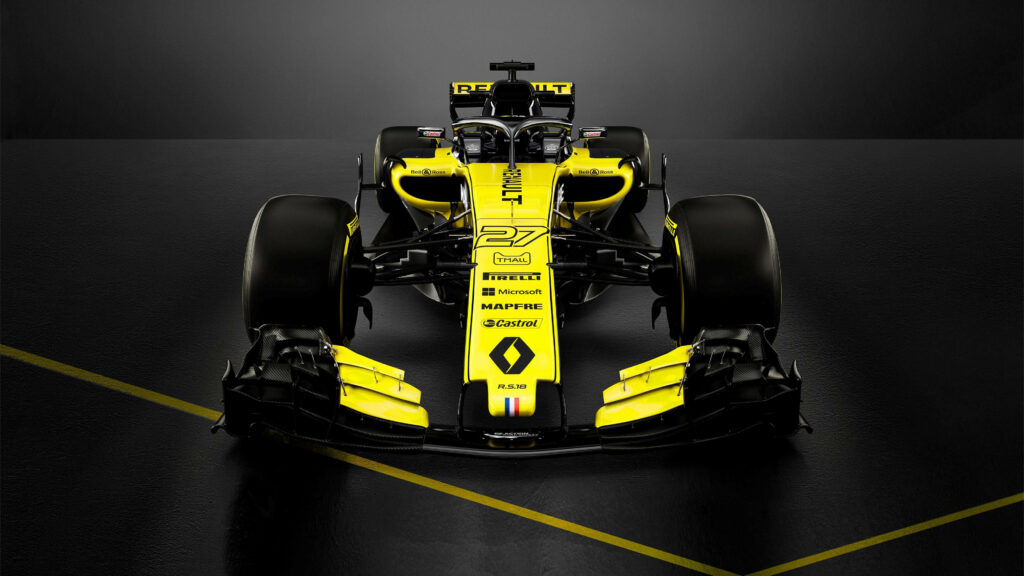 Powerful and Striking: A Captivating Shot of the Renault R.S.18 F1 Racing Car, Dominating the Frame with its Vibrant Yellow and Black Colors Wallpaper